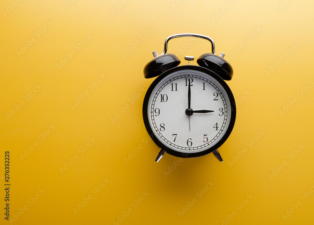 Alarm clock on yellow background top view. Concept of time. Alarm clock on yellow background top view. Concept of time.