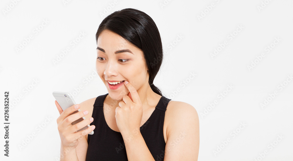 cute happy asian girl hold phone isolated on white background cute happy asian girl hold phone isolated on white background