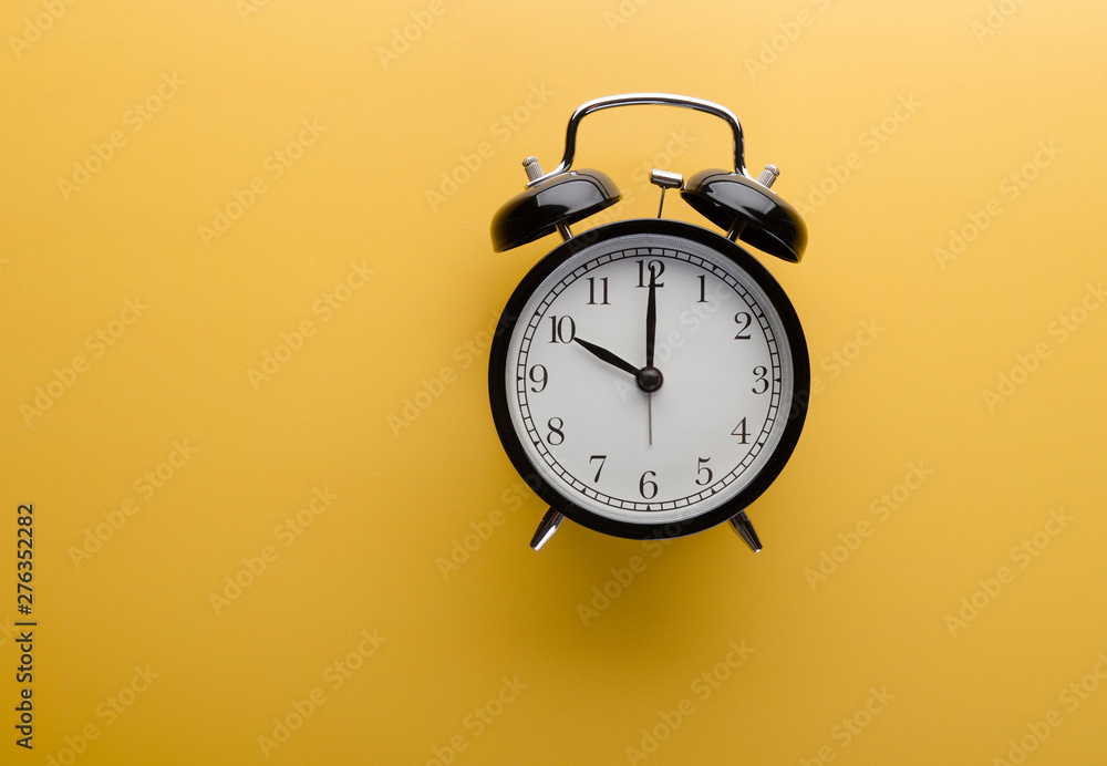 Alarm clock on yellow background top view. Concept of time. Alarm clock on yellow background top view. Concept of time.