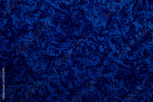 Blue colored fabric texture along with some designs of black color.Used as background or abstract background or texture.