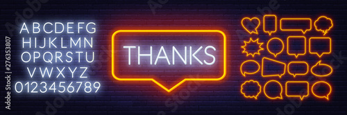 Neon sign thanks in frame on dark background.