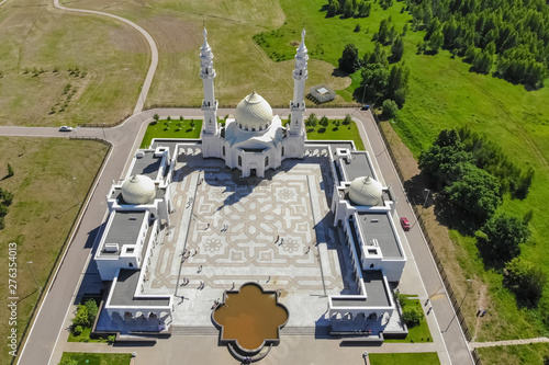 Aerial view of White mosque. Top view of the mosque lake and forest. photo