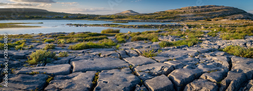 A panorama of the stunning and mars like landscape that is The Burren National Park, County Clare, Ireland at dusk.