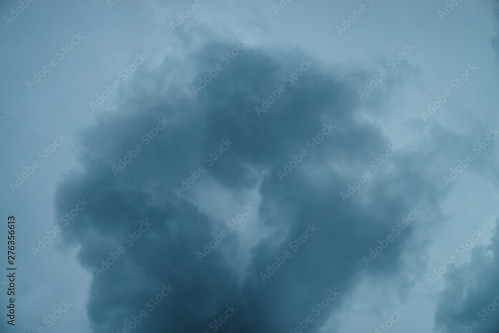 Dramatic cloudscape texture. Dark heavy thunderstorm clouds before rain. Overcast rainy bad weather. Storm warning. Natural blue background of cumulonimbus. Nature backdrop of stormy cloudy sky.