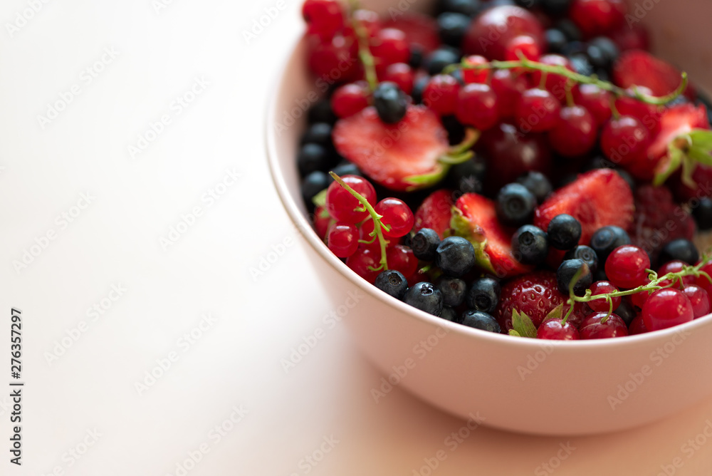 Porridge bowl oatmeal with berries on pink background. Soft focus. Healthy eating concept. Front view Porridge bowl oatmeal with berries on pink background. Soft focus. Healthy eating concept. Front view