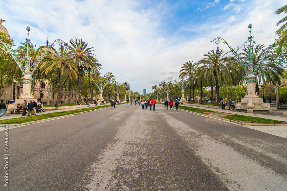 Barcelona, Spain - April, 2019: Arc de Triomf de Barcelona is a triumphal arch in the city of Barcelona in Catalonia, Spain during a cloudy day.