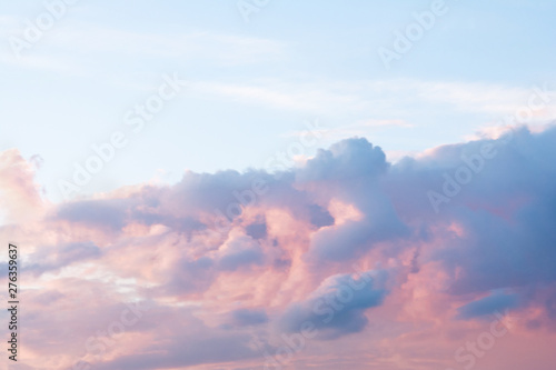 A dramatic cloud of blue, orange and pink on the blue sky in the form of a cat. © Chetgal 