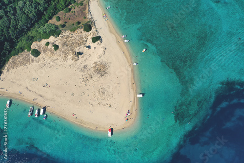 Aerial drone view of iconic small uninhabited island of Marathonisi featuring clear water sandy shore and natural hatchery of Caretta-Caretta sea turtles, Zakynthos island, Ionian, Greece