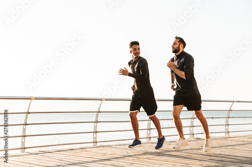 Two attractive young healthy sportsmen outdoors