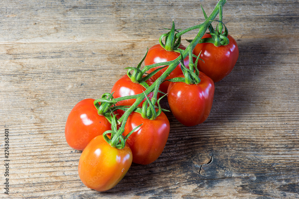 Fresh tomatoes on wood background Fresh tomatoes on wood background