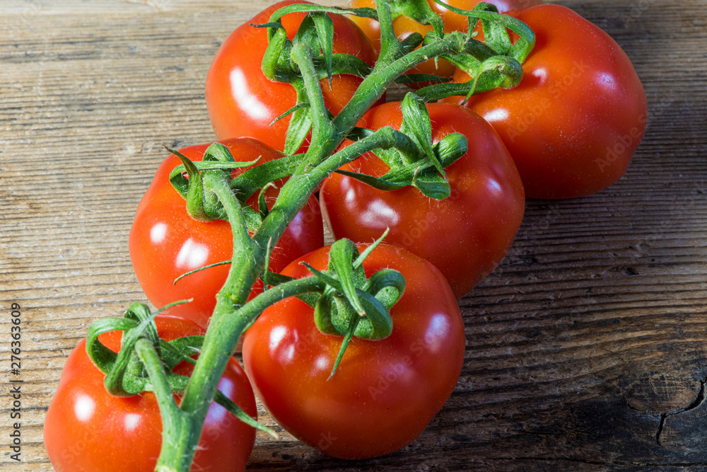Fresh tomatoes on wood background Fresh tomatoes on wood background