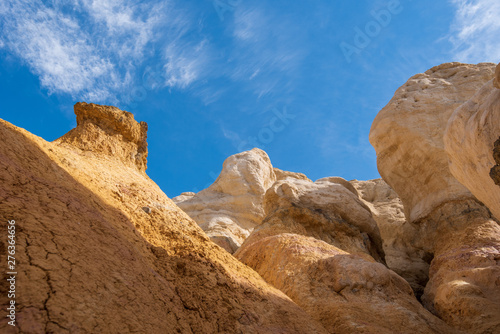 Low angle view of large yellow rock formations