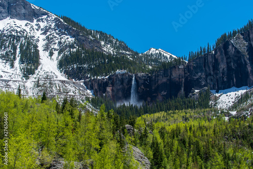 Telluride, Colorado low angle landscape of bridal veil falls, aspen trees and mountain peaks