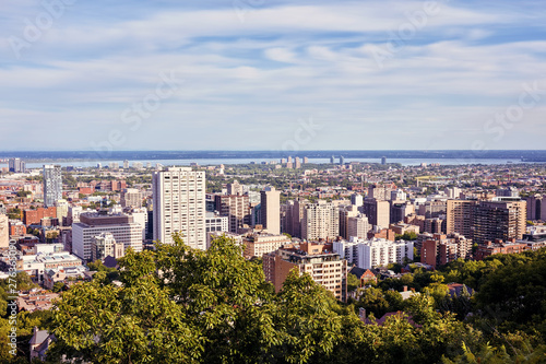 Montreal city skyline view from Mount Royal on a sunny summer afternoon in Quebec, Canada