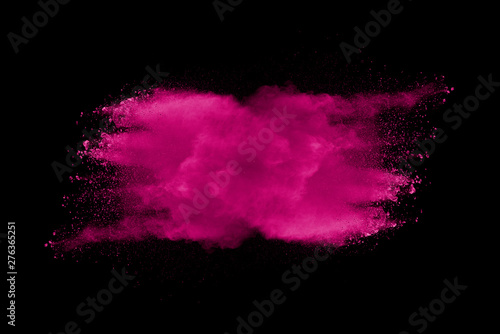 Explosion of pink dust on black background.