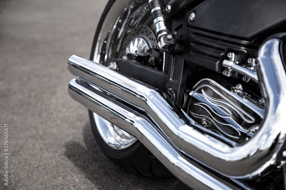 Fototapeta premium Motorcycle exhaust pipe. Chrome shiny clean motorbike tail-pipe. Close up view.