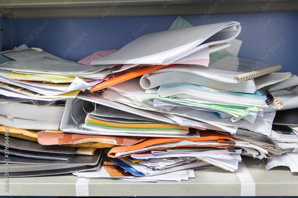 Messy file document and Office Supplies in filing cabinets at work office Messy file document and Office Supplies in filing cabinets at work office