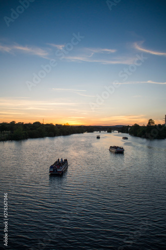 View over boats at Colorado river at sunset, Texas.