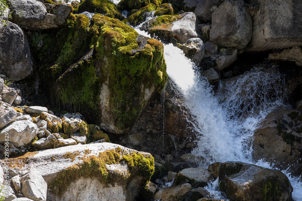 mountain wooded waterfall among the rocks in summer mountain wooded waterfall among the rocks in summer