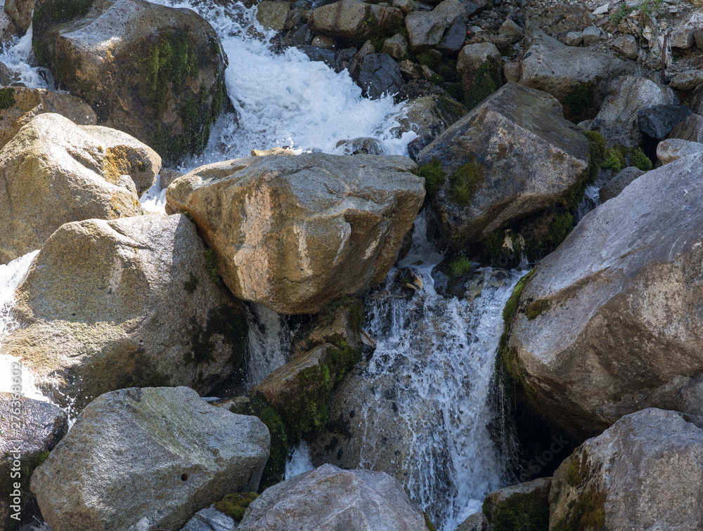 mountain wooded waterfall among the rocks in summer mountain wooded waterfall among the rocks in summer