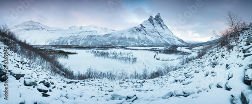 Beautiful landscape scene with Signaldalelva river and Otertinden mountain in background in Northern Norway . Sunset or sunrise in Mountains And Fjords, Winter Landscape.