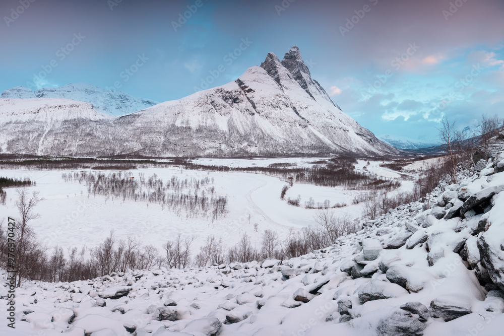 Beautiful landscape scene with Signaldalelva river and Otertinden mountain in background in Northern Norway . Sunset or sunrise in Mountains And Fjords, Winter Landscape.