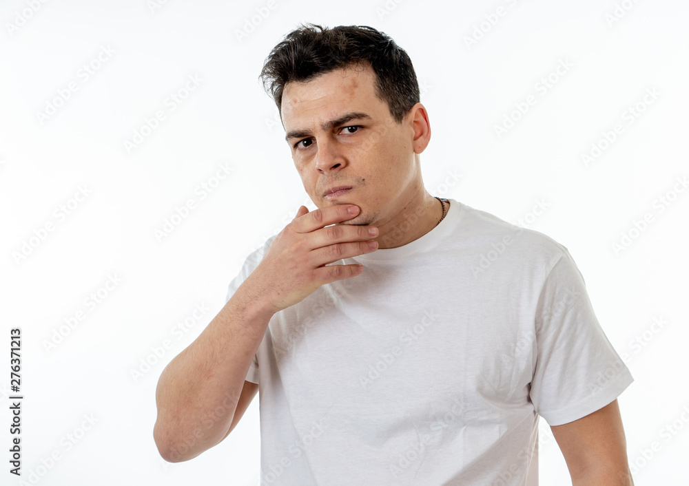 Human expressions and emotions. Young attractive man with an angry face, looking furious and crazy Human expressions and emotions. Young attractive man with an angry face, looking furious and crazy