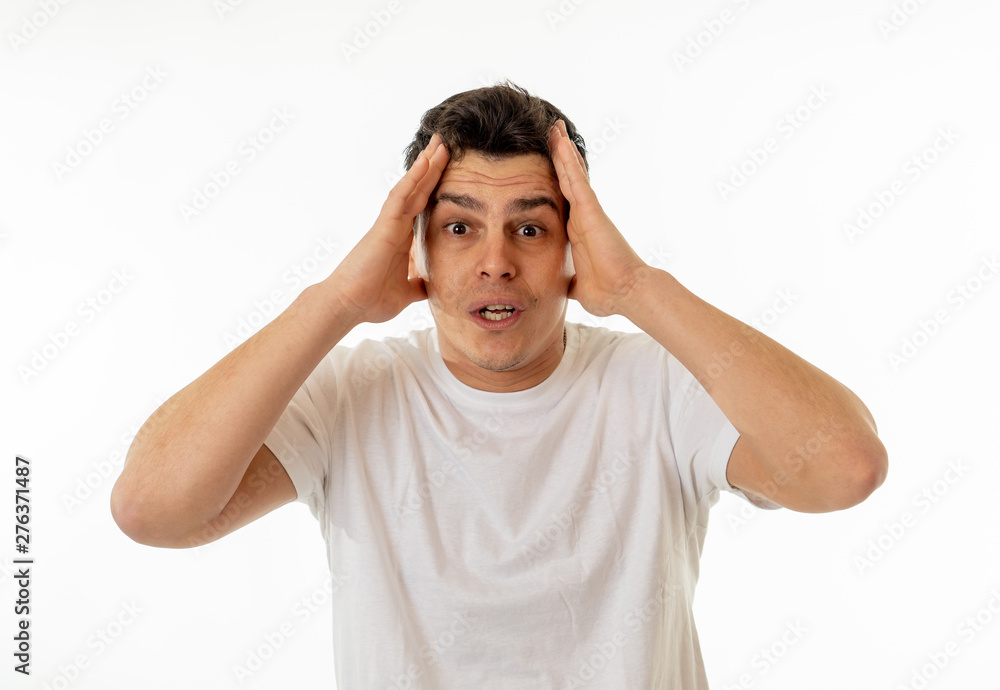 Fototapeta premium Portrait of amazed man feeling lucky, happy and surprised of winning something and being successful