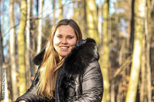 portrait of young woman in autumn park