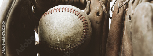 Photography Baseball banner shows old rugged ball in mitt close up for sport gear