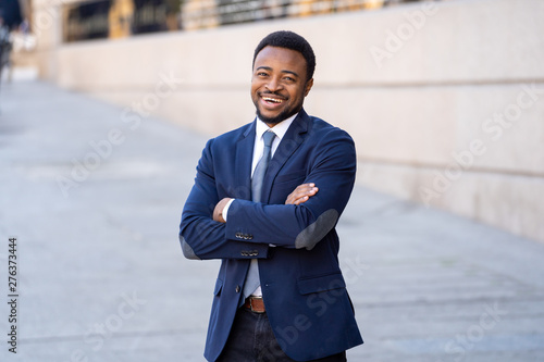 Vászonkép Half length portrait of an attractive stylish and successful businessman outside