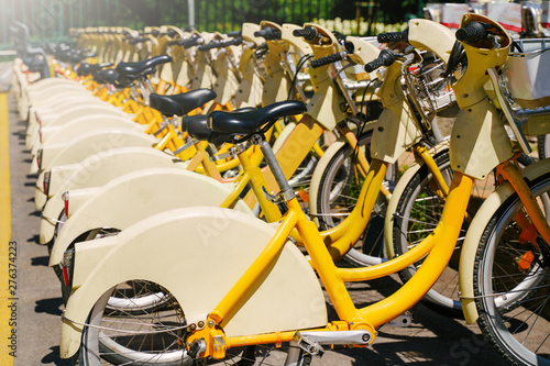 Many bicycles for rent on bike station