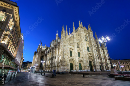Milan Cathedral at Piazza del Duomo square. City center illuminated at night. Milano, Italy
