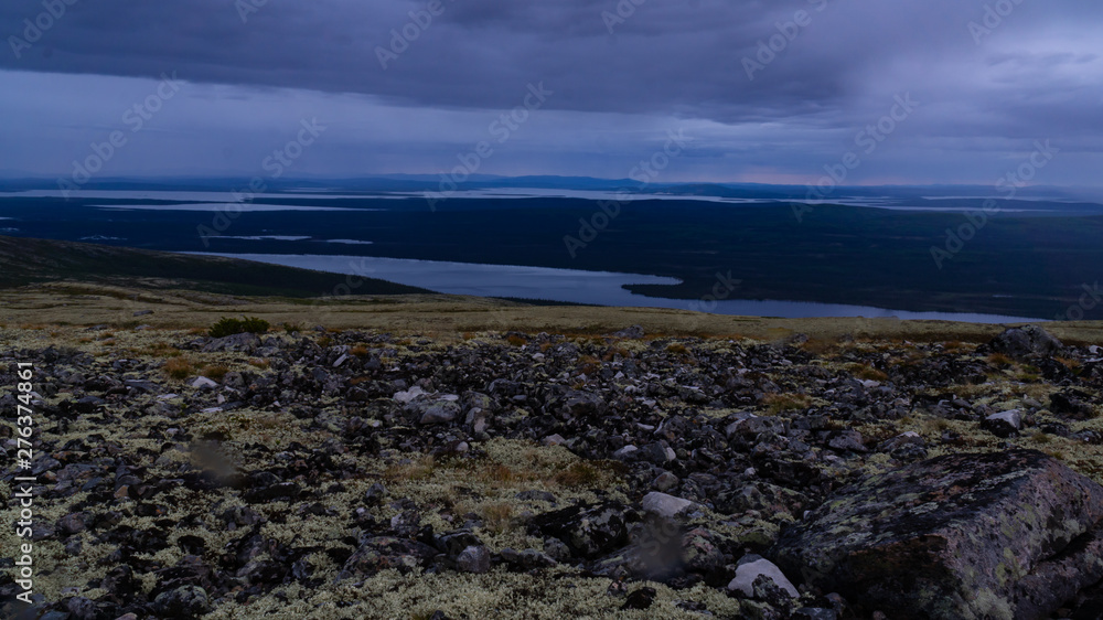 Fototapeta premium Rays of the setting sun over the mountain valley Khibiny