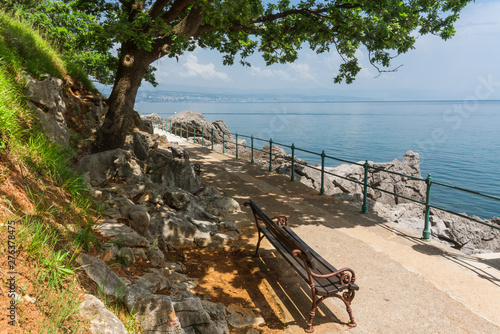 bench on the boulevard along the Adriatic Sea. Path between Opatija and Lovran, Croatia photo