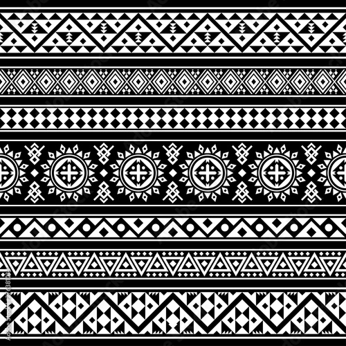 Ikat Aztec ethnic design in black background. Seamless pattern ethnic tile vector illustration. 