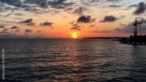 Timelapse sunset on the horizon of the sea.