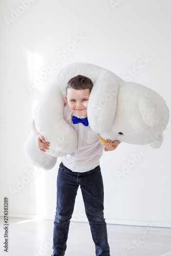 boy with a soft toy of a large bear