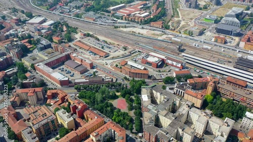 Aerial,, drone shot towards the railway station, in Bologna city, on a sunny day, in Toscany, Italy photo