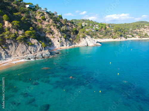 Aerial view of beautiful coastline in Mediterranean coast of Spain, Costa Brava. Panorama of Rocks on the coast in beautiful summer day. Beautiful beach with turquoise sea, holiday destination