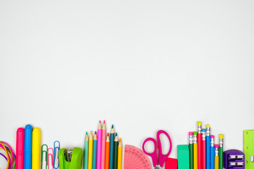 School supplies bottom border. Top view on a white background with copy space. Back to school concept.