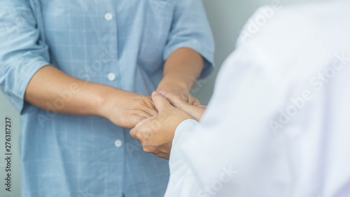 Female doctors comfort the patients at the consultation room - medical concept