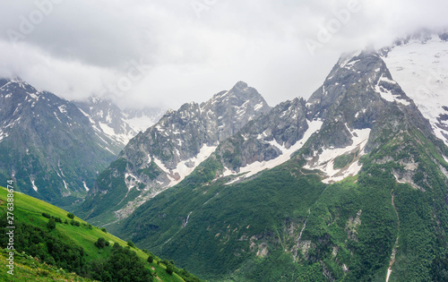Dombay mountain range in the Caucasus in summer, snow-capped peaks and green mountain slopes © Igor Luschay