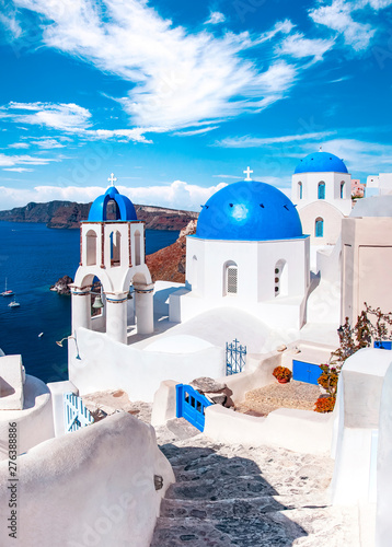 Traditional and famous houses and churches with blue domes over the Caldera, Oia, Santorini, Greece island, Aegean sea. Beautiful view of White Greek architecture. Travel, Famous travel destination