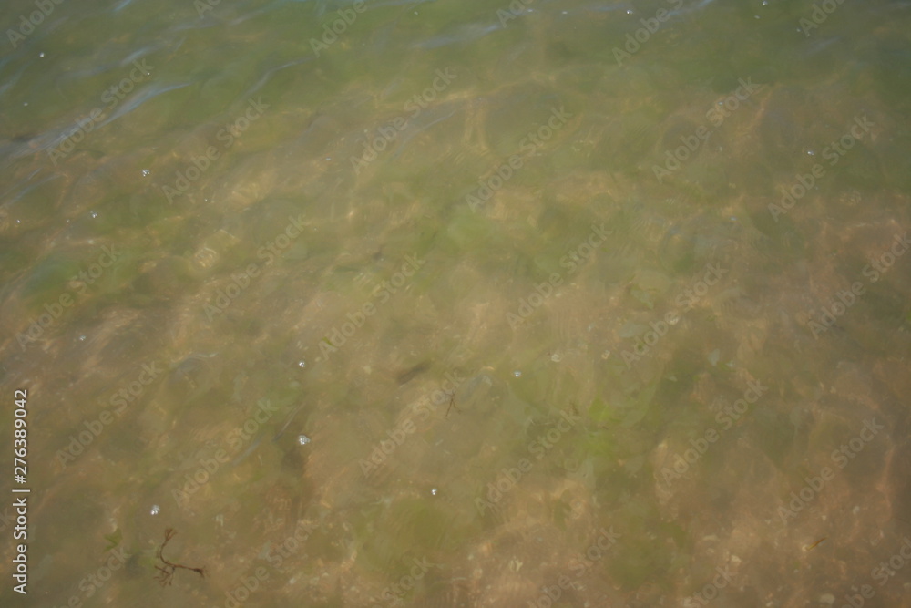 Spanish beach , water with waves at summer