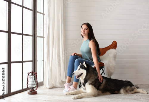 Young woman with cute Husky...