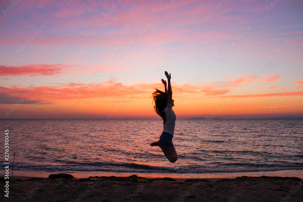 Woman , Jumping and Sunset , Holidays Concept