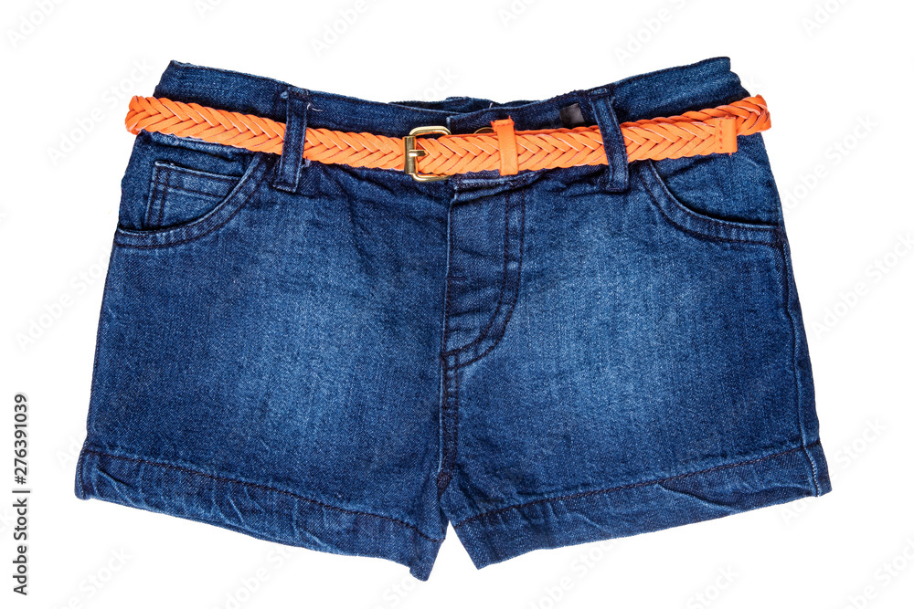 Jeans shorts isolated. Trendy stylish short jeans pants with orange leather belt for child girl isolated on a white background. Fashionable denim short pants. Stock Adobe Stock