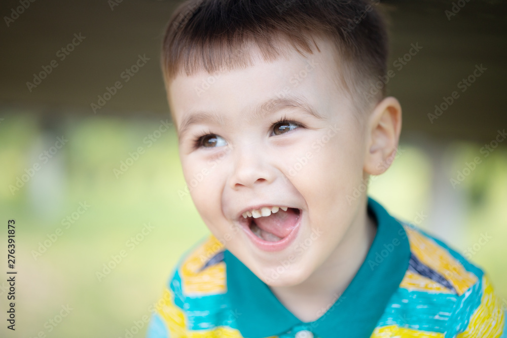 Little boy show emotions at park background with ligh.manifestation of emotions. boy screaming Little boy show emotions at park background with ligh.manifestation of emotions. boy screaming