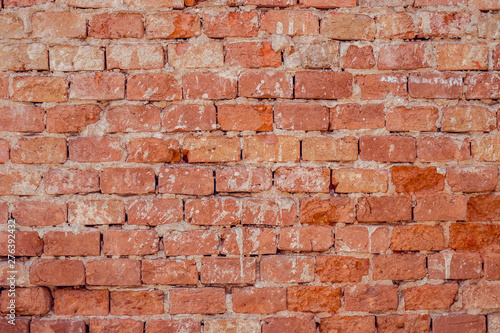 Background of old red brick wall with rough weathered texture – Vintage architectural solid structure of a building exterior